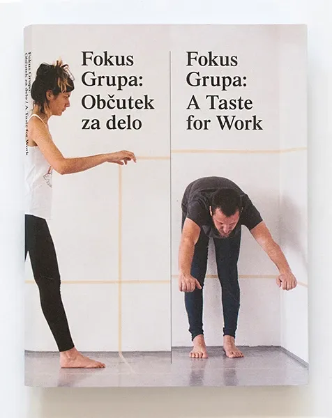 The cover: two figures bending and stretching against a white wall, with the title in Slovenian and English