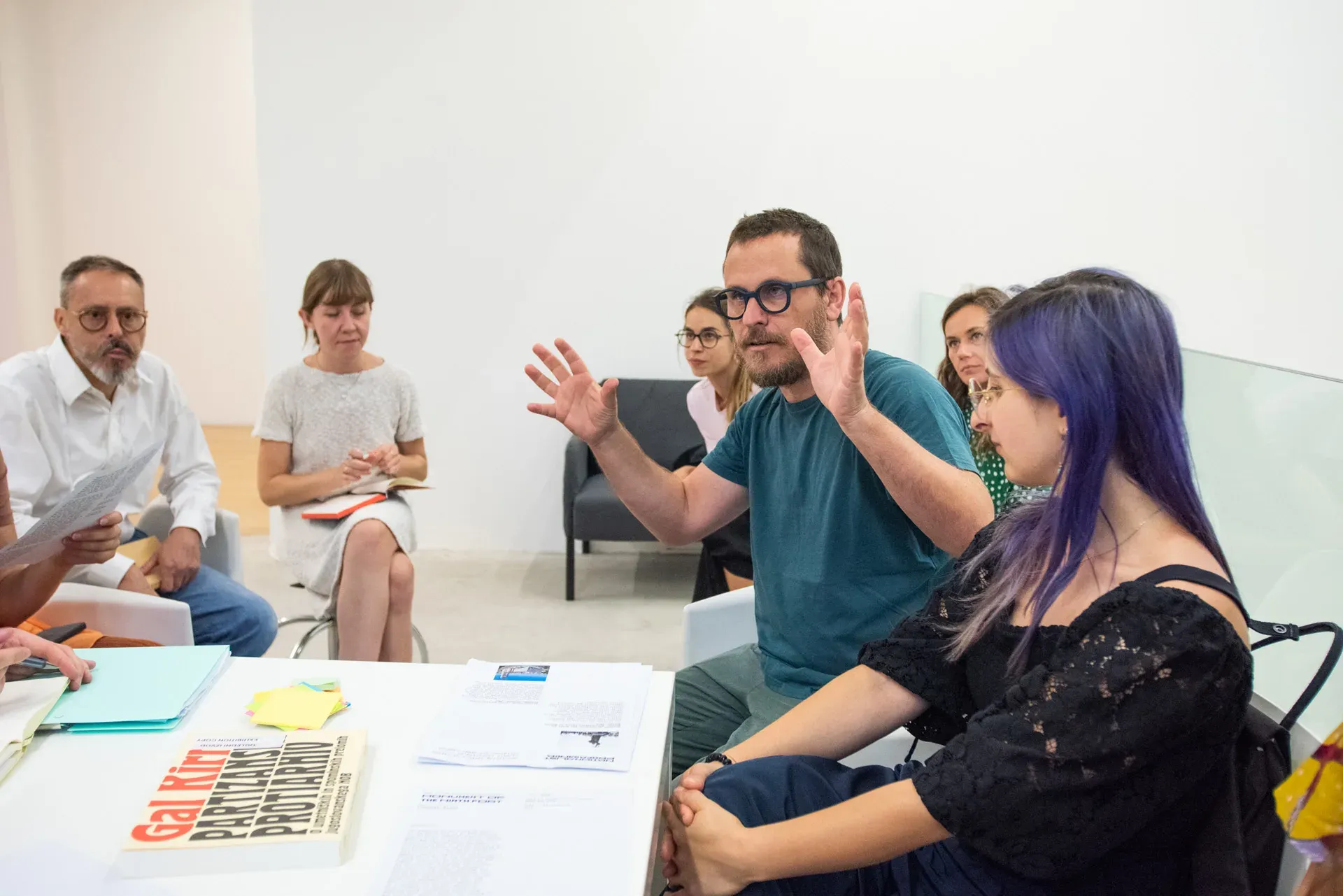 A workshop discussion, with a book by Gal Kirn on the table