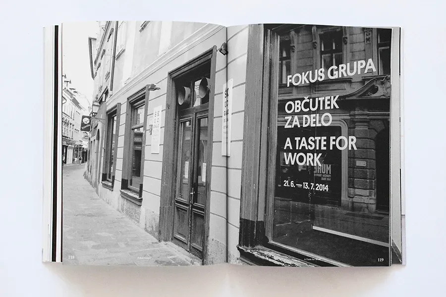 A black-and-white photograph of the gallery window with the exhibition title and dates