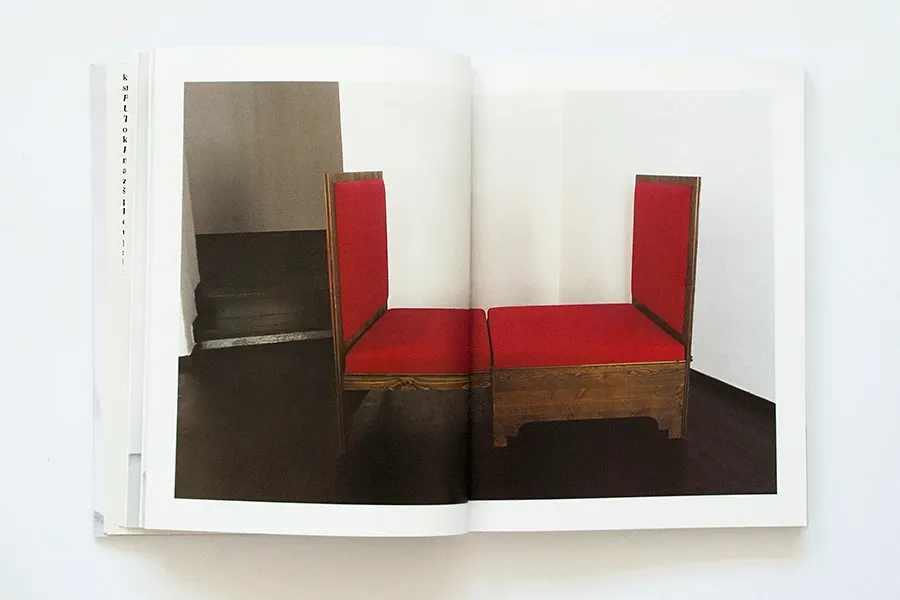 A spread with a photograph of the reconstructed red sofa-bed